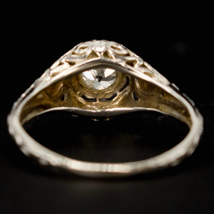 18K White Gold Art Deco 0.59 Carat European Cut Diamond Filigreed Solitaire with Floral Motif