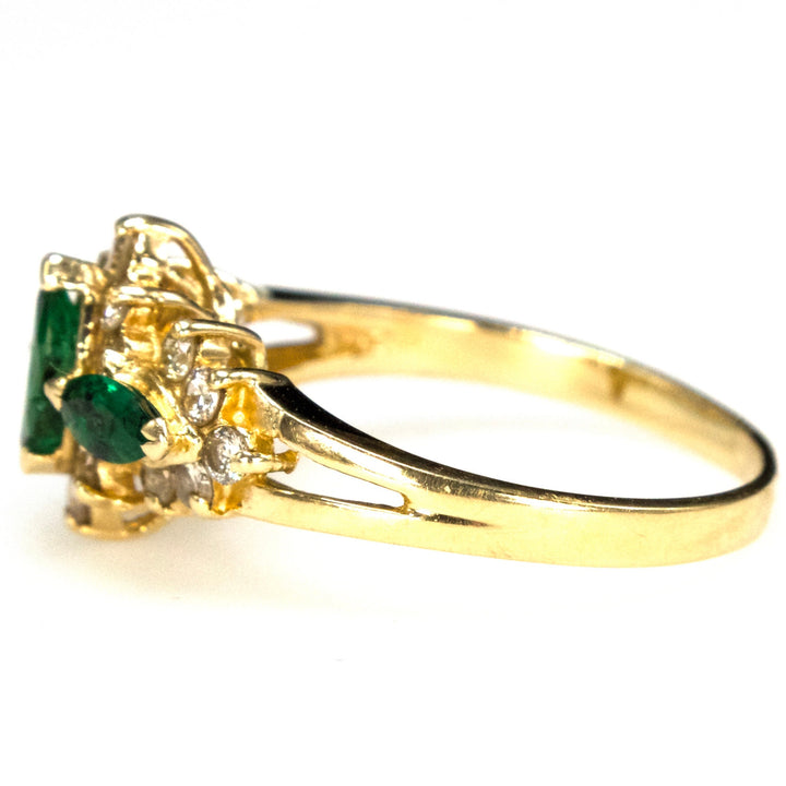 Vintage Three Stone Marquise Cut Emerald Ring with Diamond Surround in Gold
