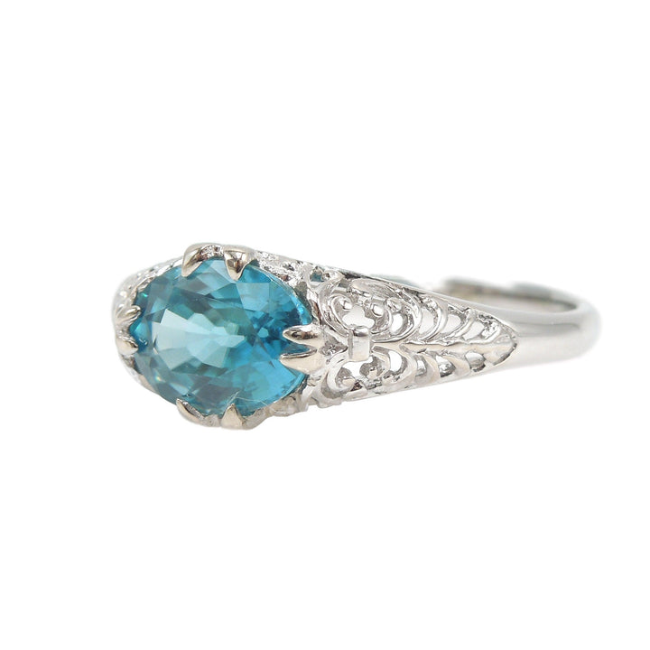 Art Deco Style Filigree Ring in 14K White Gold with Oval Blue Zircon Set Sideways