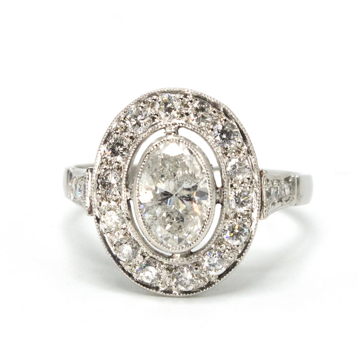 Art Deco 0.79 Carat Oval Diamond Ring with Halo in Platinum