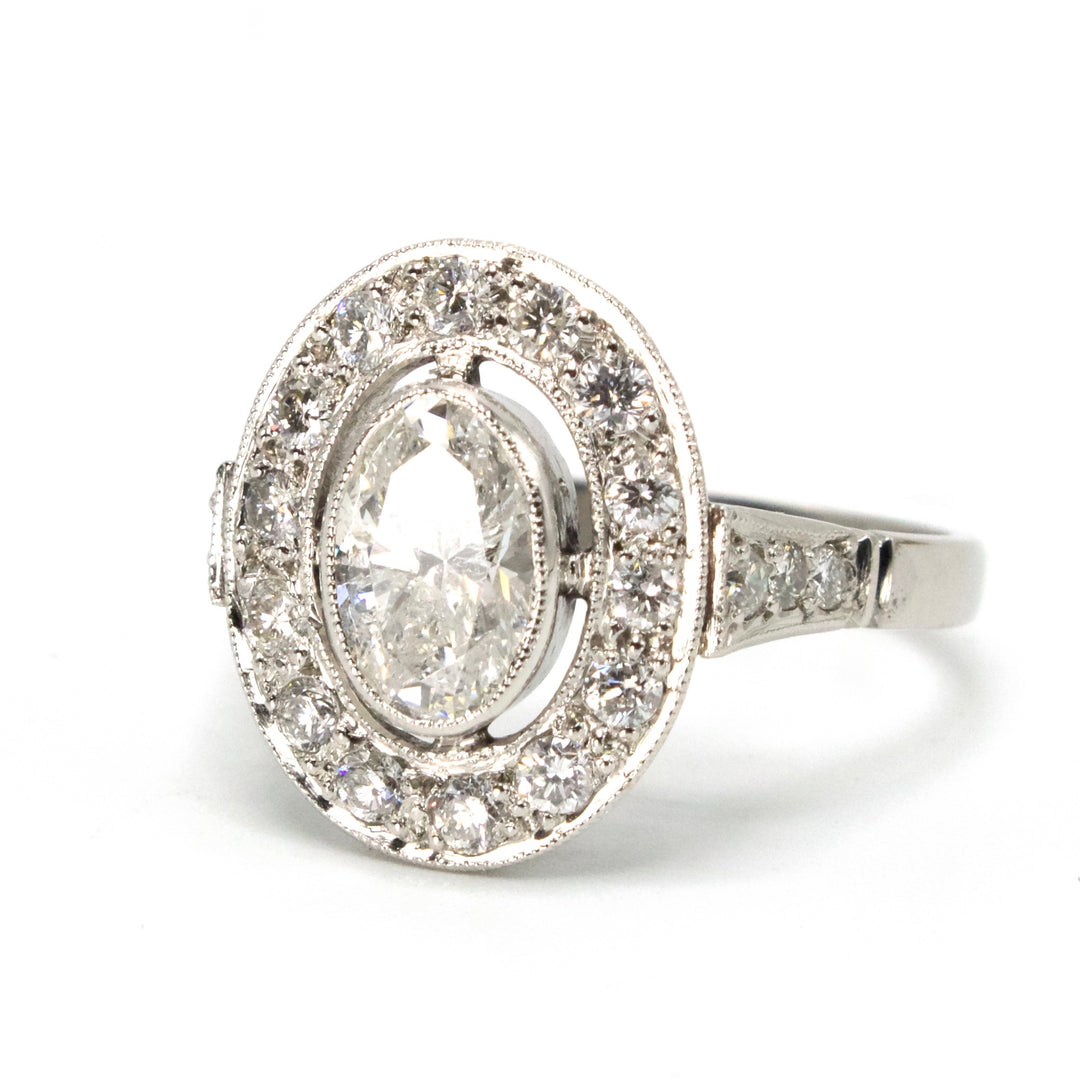 Art Deco 0.79 Carat Oval Diamond Ring with Halo in Platinum