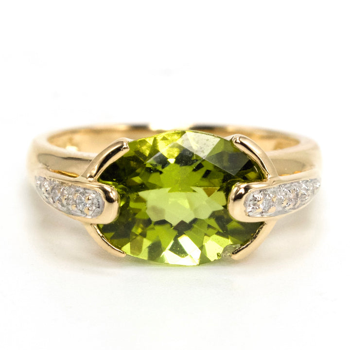 Oval Vivid Green Peridot Set East-West in 14K Yellow Gold Setting with Diamonds