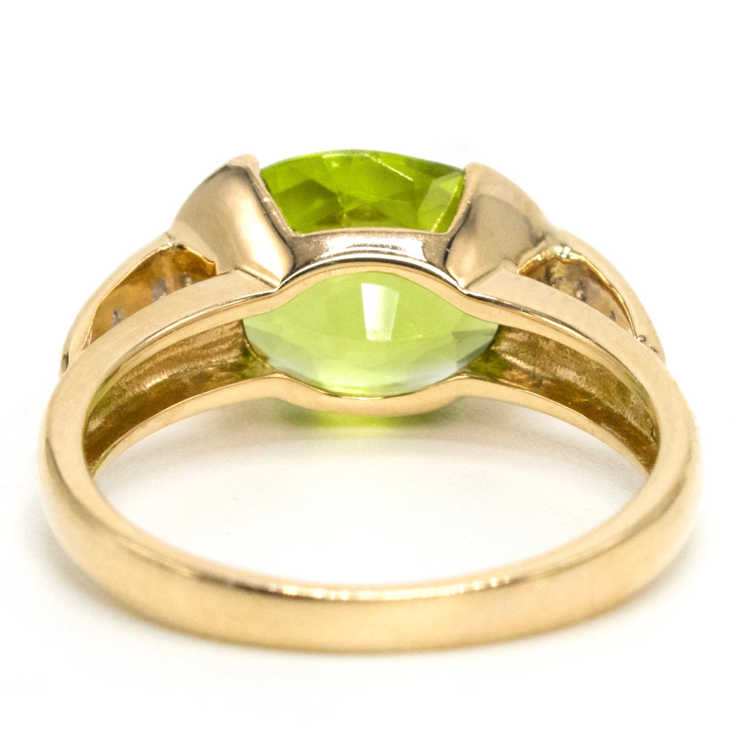 Oval Vivid Green Peridot Set East-West in 14K Yellow Gold Setting with Diamonds