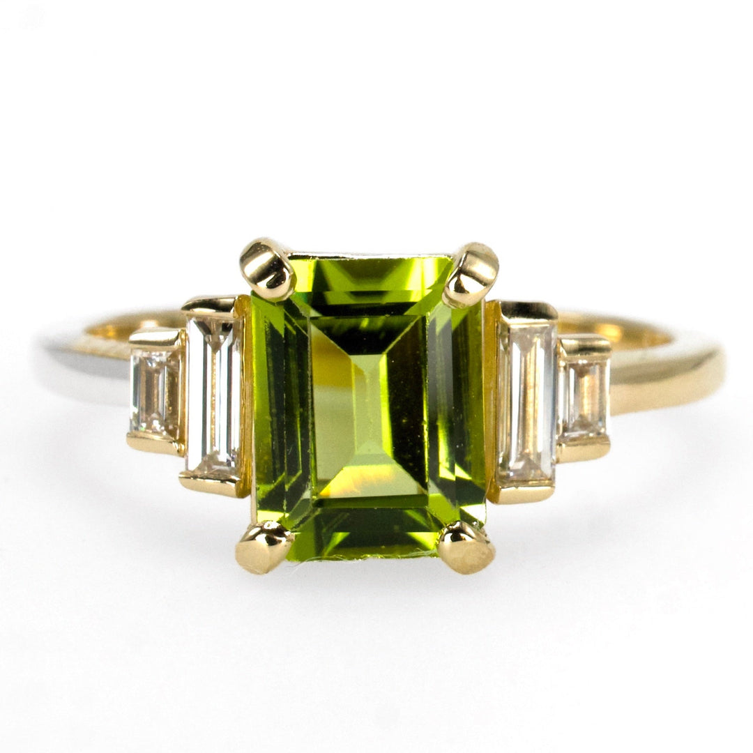 1.40 Carat Emerald Cut Peridot with Graduated Baguette Diamond Accents in Gold