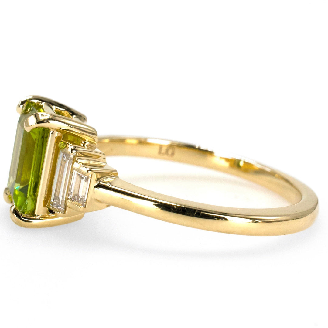 1.40 Carat Emerald Cut Peridot with Graduated Baguette Diamond Accents in Gold