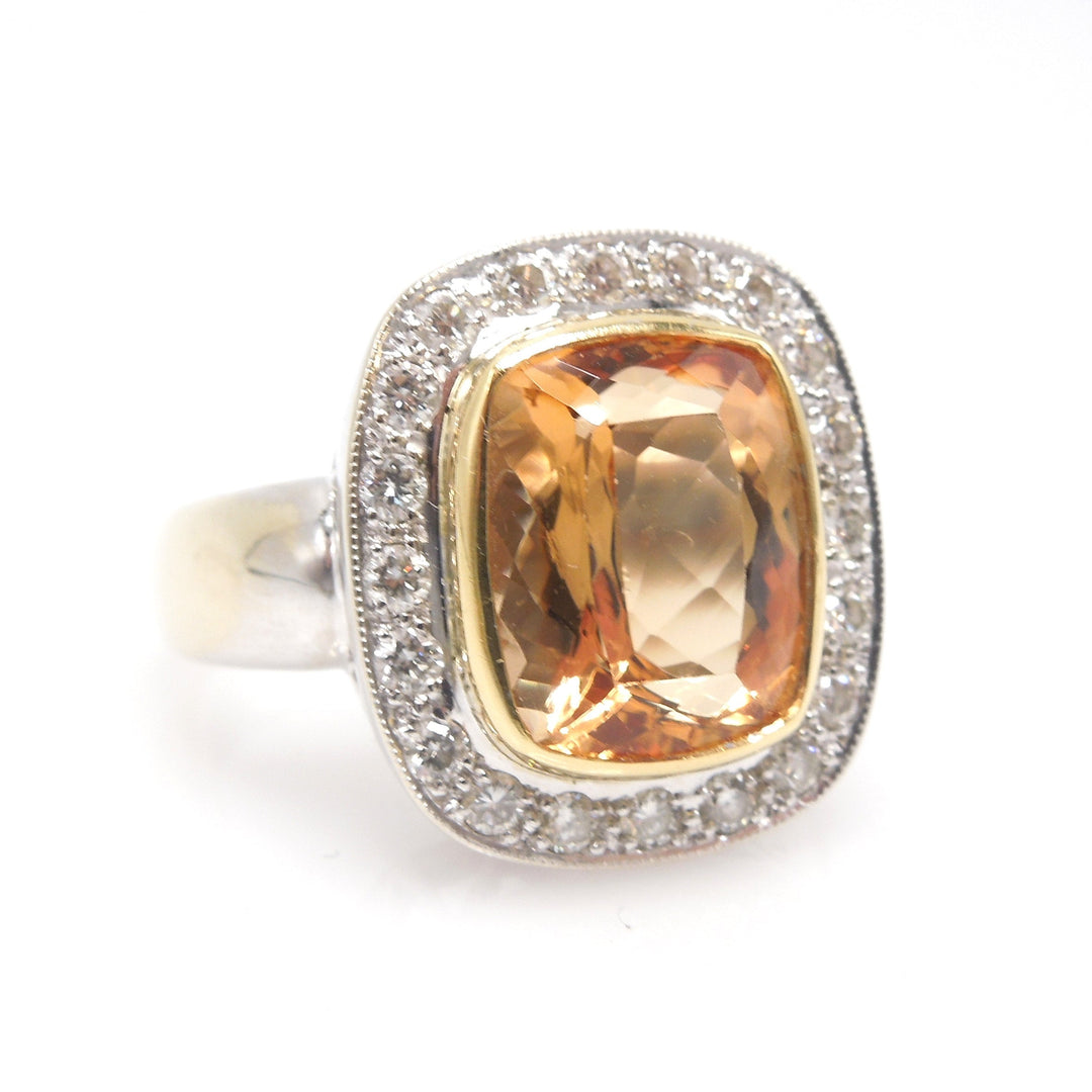 Approximately 6.00 Carat Precious Topaz Ring with Diamond Halo in 18K