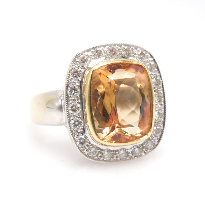Approximately 6.00 Carat Precious Topaz Ring with Diamond Halo in 18K