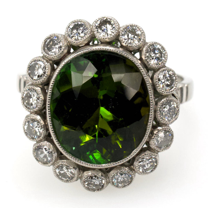 Art Deco Style Platinum Ring with 4.81 Carat Green Tourmaline and Bezel Set Diamond Halo