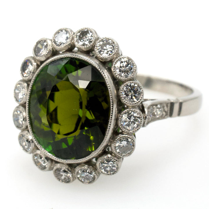 Art Deco Style Platinum Ring with 4.81 Carat Green Tourmaline and Bezel Set Diamond Halo