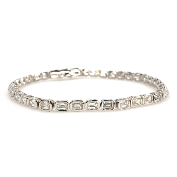 18K White Gold Tennis Bracelet with 4.95 Carats of Natural Emerald Cut Diamonds in Bezels