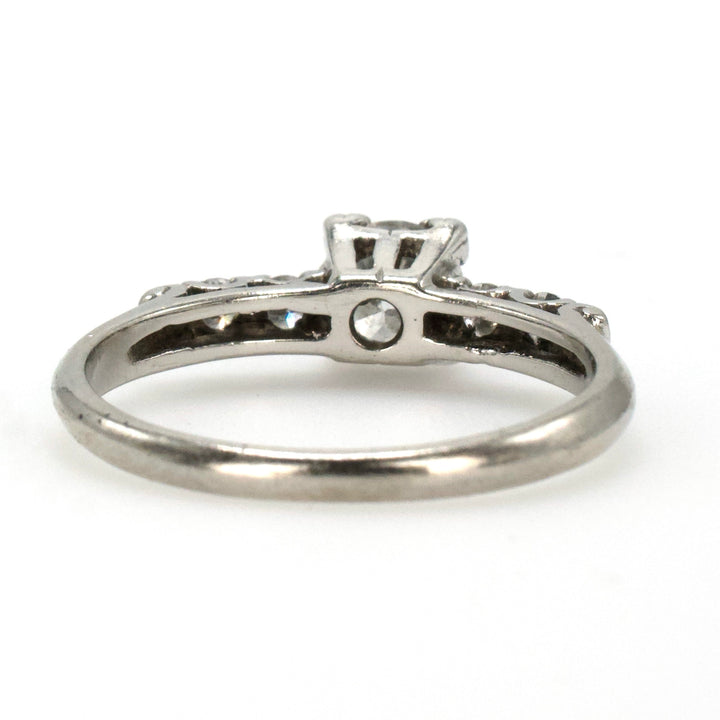 Midcentury Platinum Diamond Engagement Ring with Transitional Cut Diamond and Four Accent Diamonds