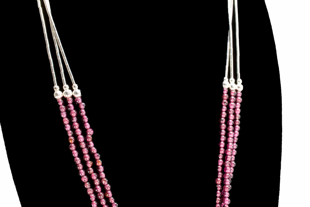 Knotted Triple Strand Necklace of Sterling Silver and Rubellite Tourmaline Beads