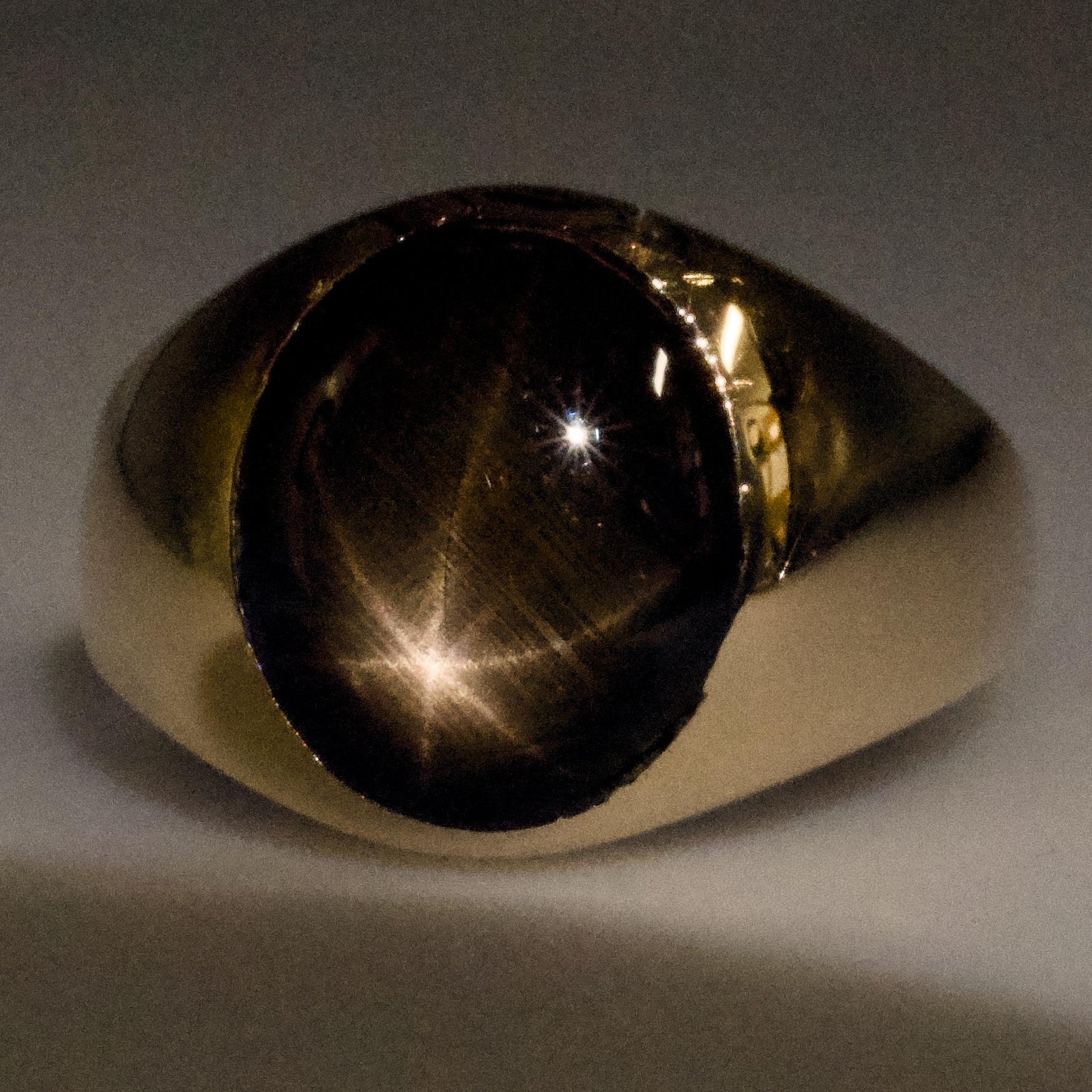 Oval Black Star Sapphire Signet Ring in Gold