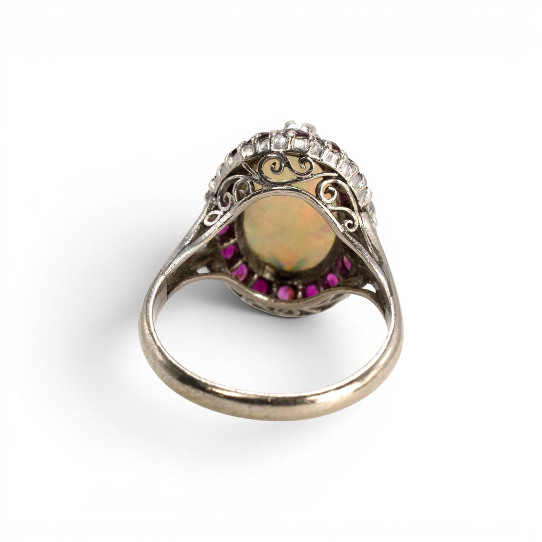 Large Oval Opal and Ruby Halo Ring in White Gold