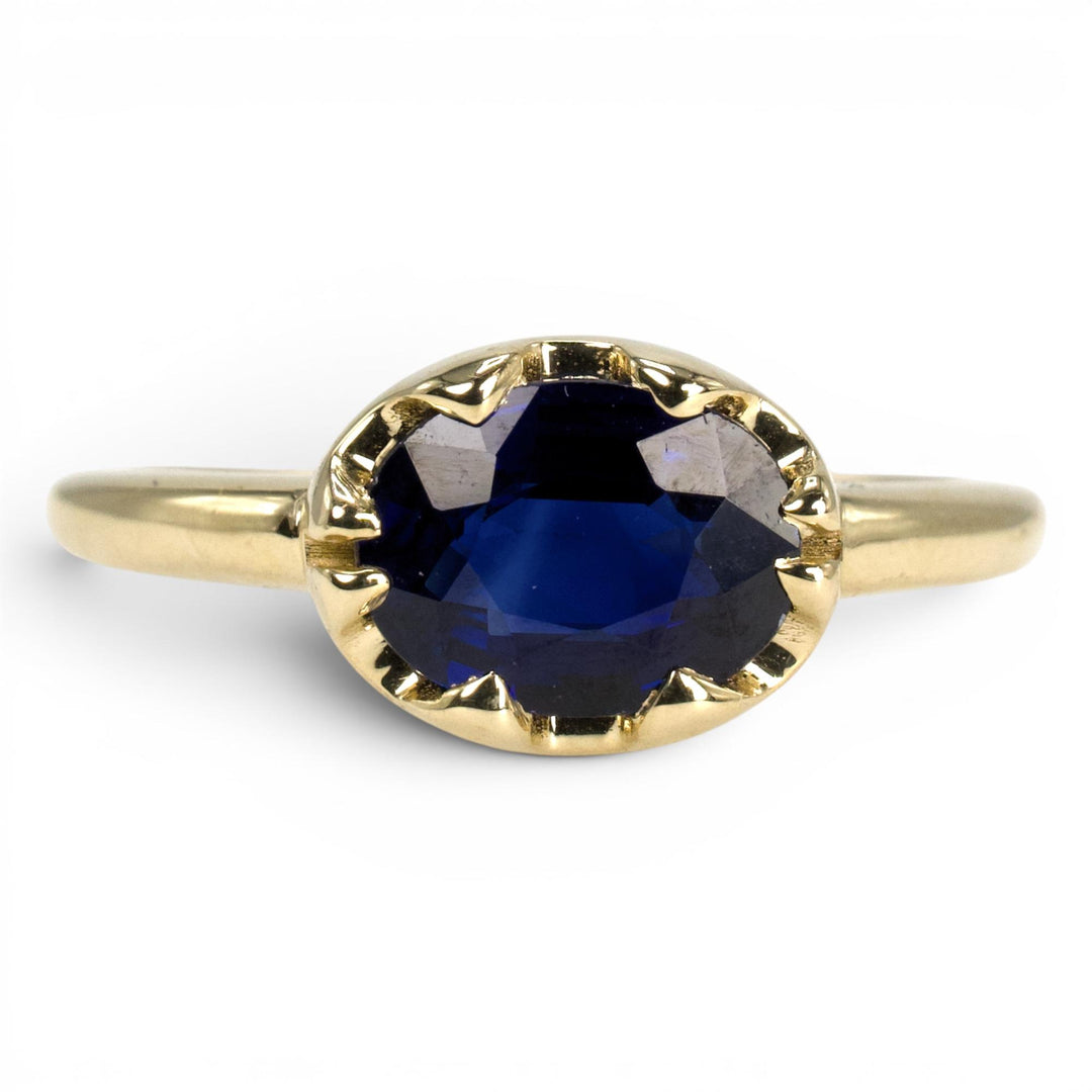 1.54 Carat Oval Blue Sapphire in East-West Belcher Inspired Gold Ring