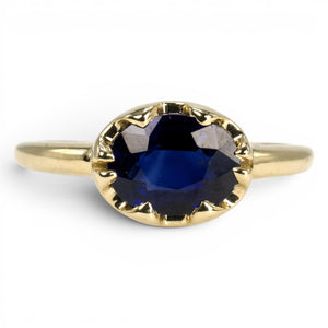 1.54 Carat Oval Blue Sapphire in East-West Belcher Inspired Gold Ring
