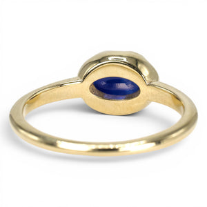 1.54 Carat Oval Blue Sapphire in East-West Belcher Inspired Gold Ring