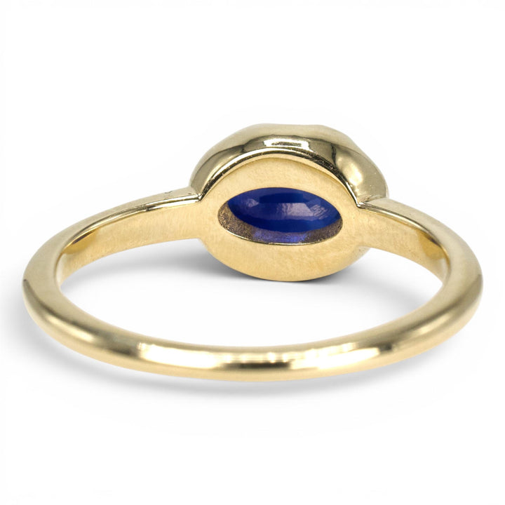 1.54 Carat Oval Blue Sapphire in East-West Belcher Inspired Gold Ring