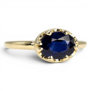 1.54 Carat Oval Blue Sapphire in East-West Belcher Inspired Gold Ring