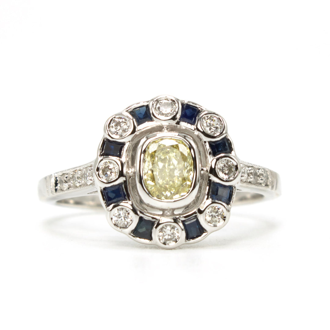 Fancy Yellow Cushion Cut Diamond with Diamond and Sapphire Halo