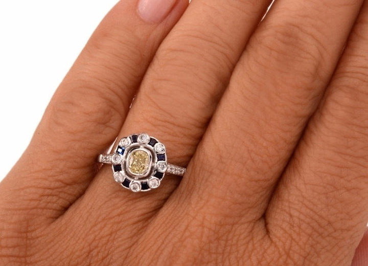 Fancy Yellow Cushion Cut Diamond with Diamond and Sapphire Halo