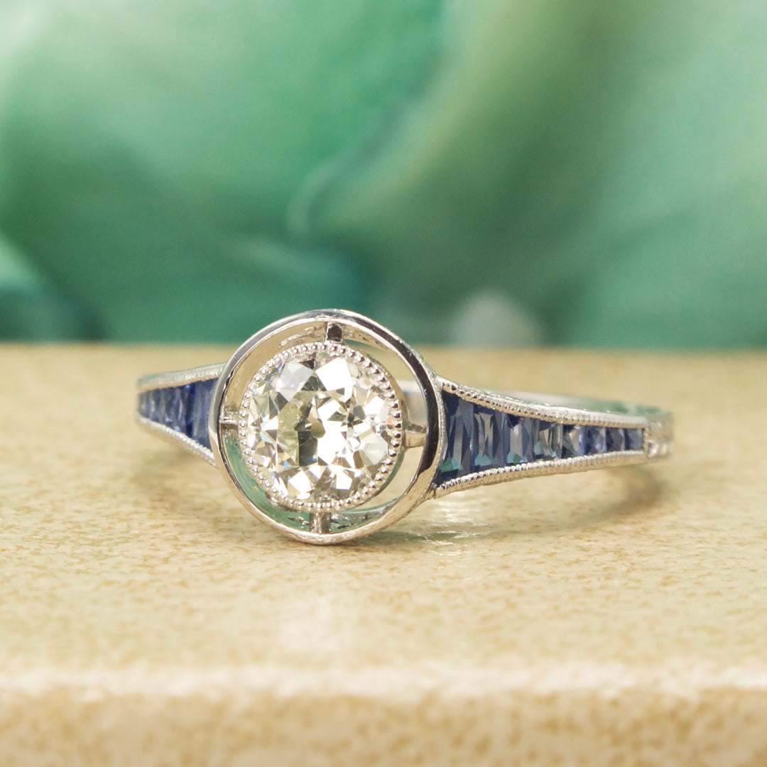 Art Deco Style 0.71 Carat European Cut Diamond in Sapphire Accented Platinum Setting