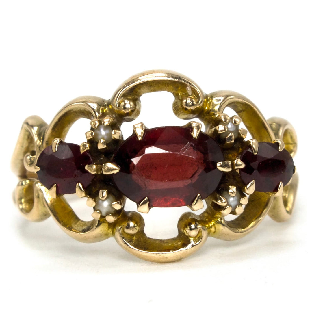 Three Stone Oval Red Garnet Ring with Seed Pearl Accents from the 1930s