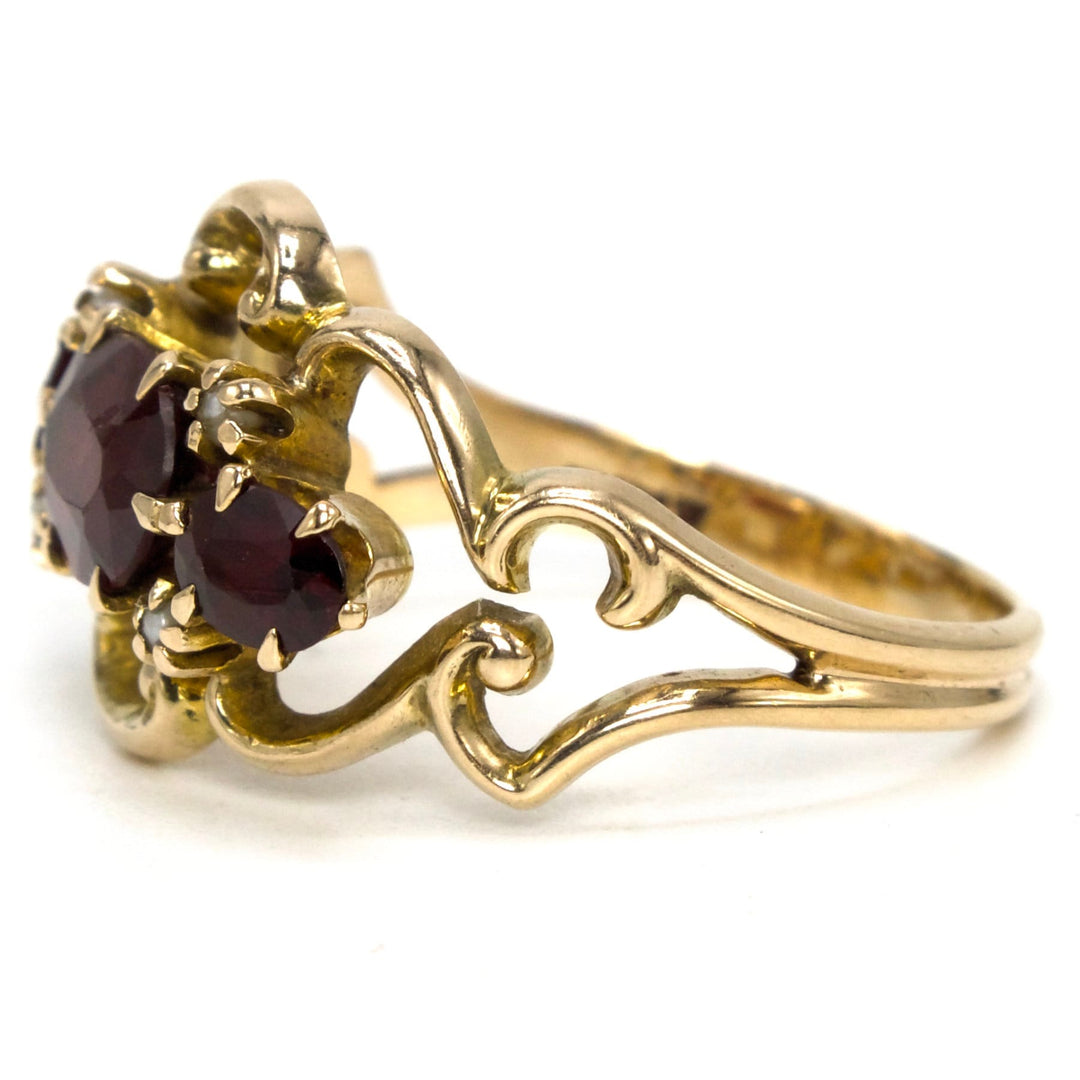 Three Stone Oval Red Garnet Ring with Seed Pearl Accents from the 1930s