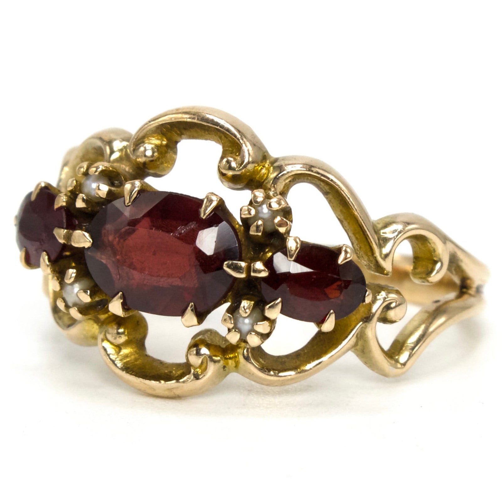 Three Stone Oval Red Garnet Ring with Seed Pearl Accents from the 1930s