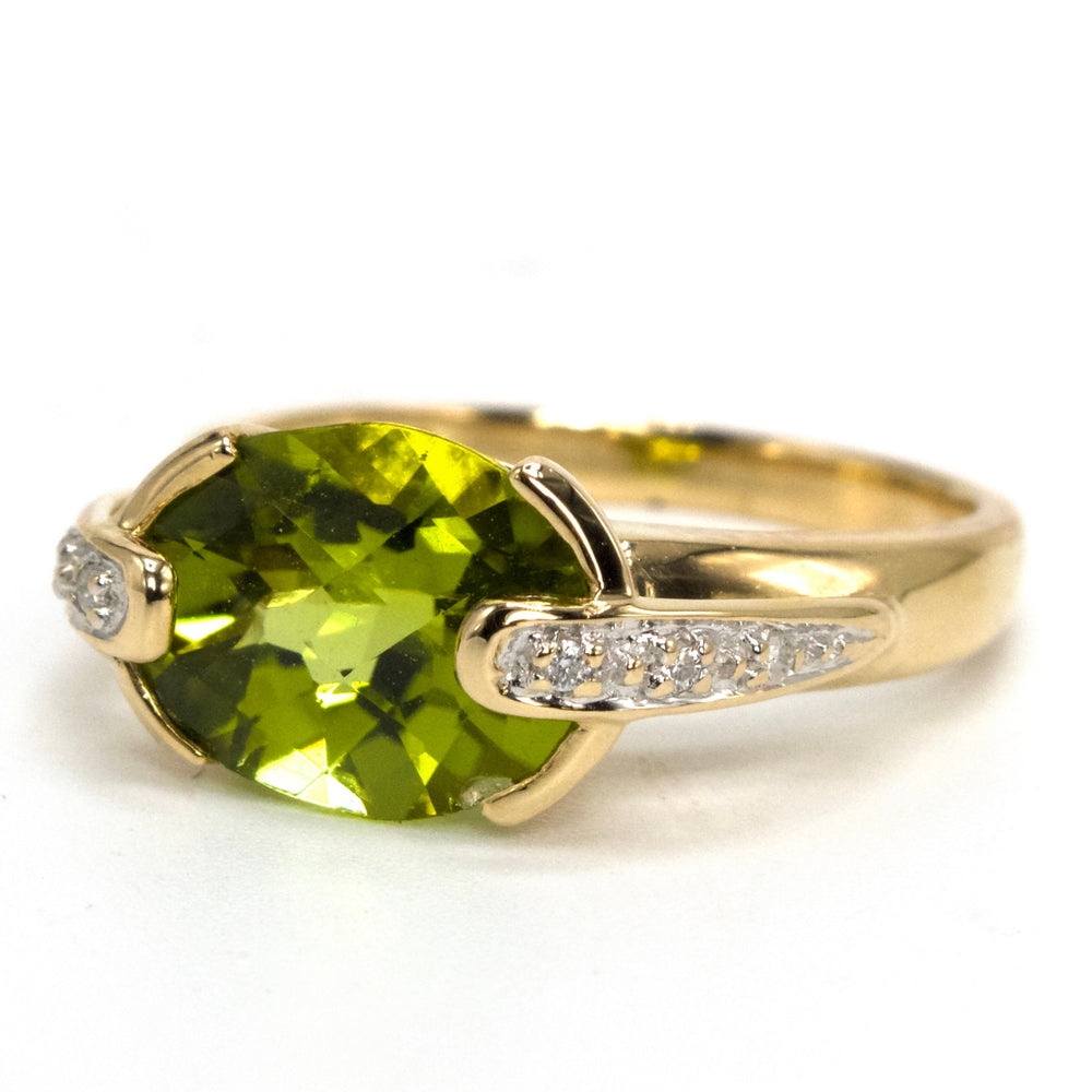 Oval Vivid Green Peridot Set East-West in 14K Yellow Gold Setting with Diamonds