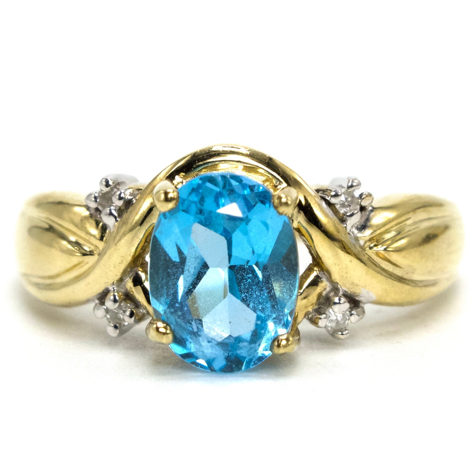 Criss Cross Gold Ring with Oval Blue Topaz and Accent Diamonds