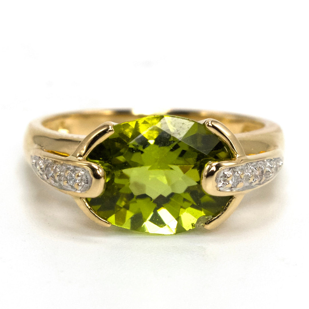 Oval Vivid Green Peridot Set East-West in 14K Yellow Gold Setting with Diamonds