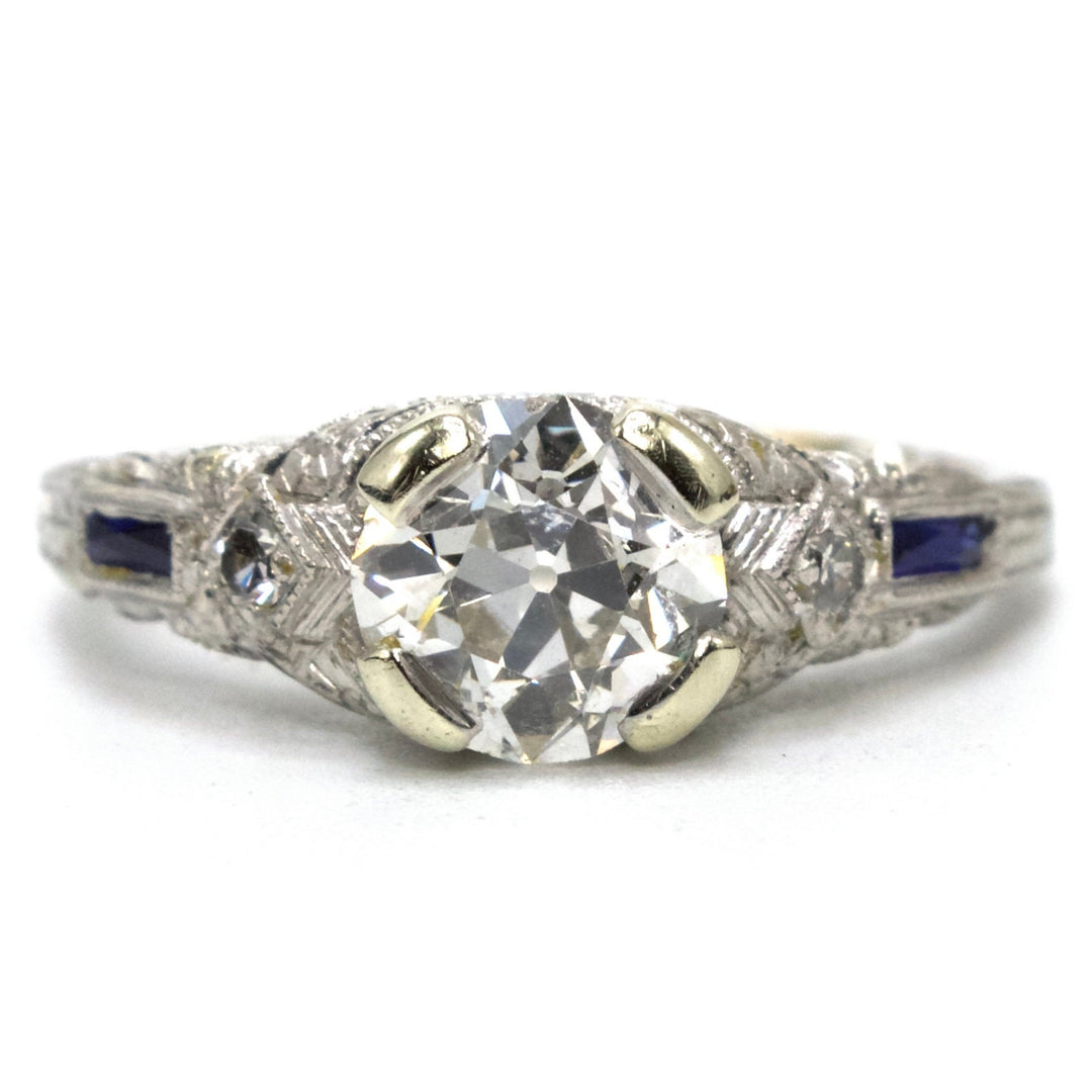 Art Deco Platinum and 1.00 Carat European Cut Diamond Filigreed Engagement Ring with Sapphire Baguette Accents