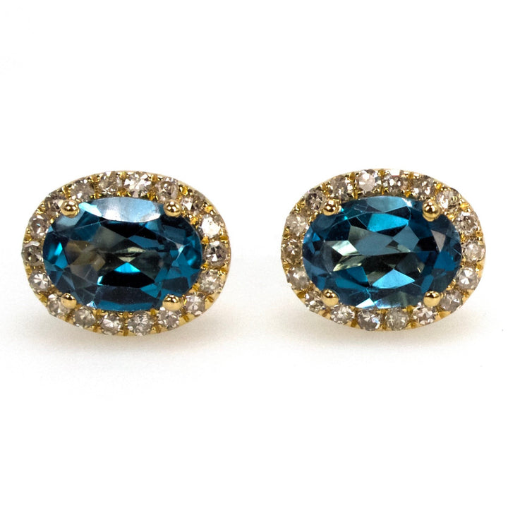 Oval London Blue Topaz Stud Earrings with Diamond Halo in Yellow Gold