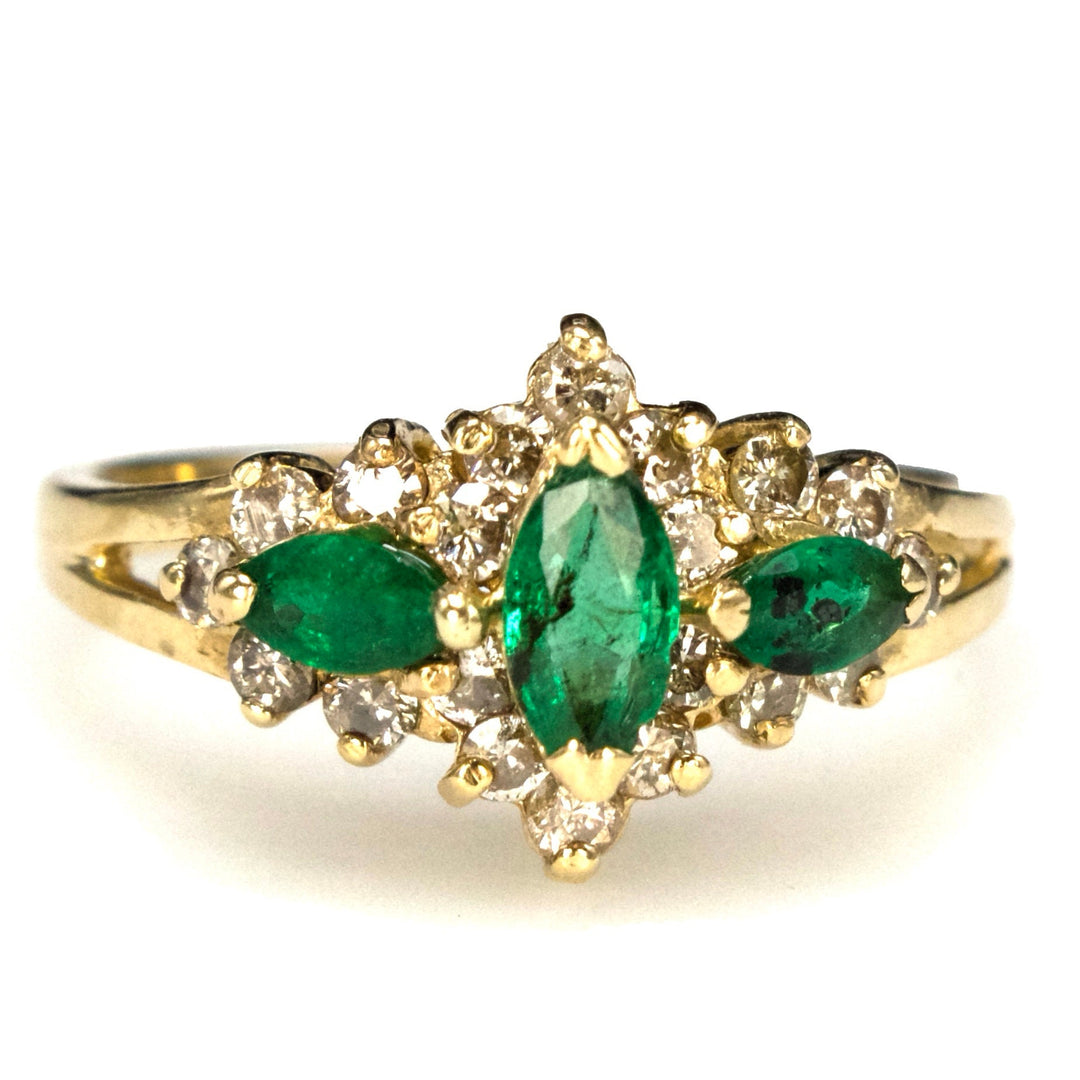 Vintage Three Stone Marquise Cut Emerald Ring with Diamond Surround in Gold