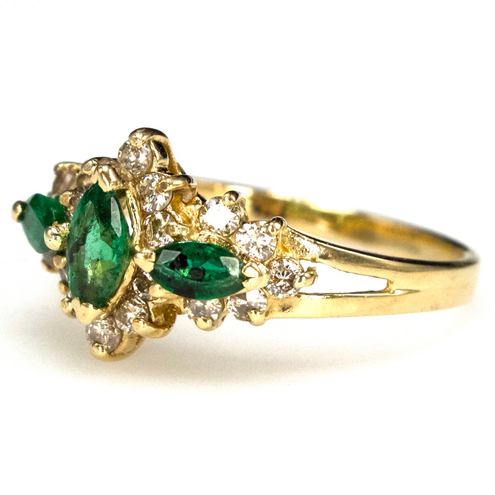 Vintage Three Stone Marquise Cut Emerald Ring with Diamond Surround in Gold