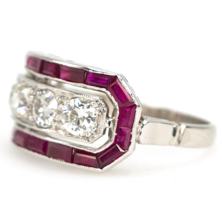 Art Deco Style Four Diamond Ring with Calibre Cut Ruby Surround in Platinum