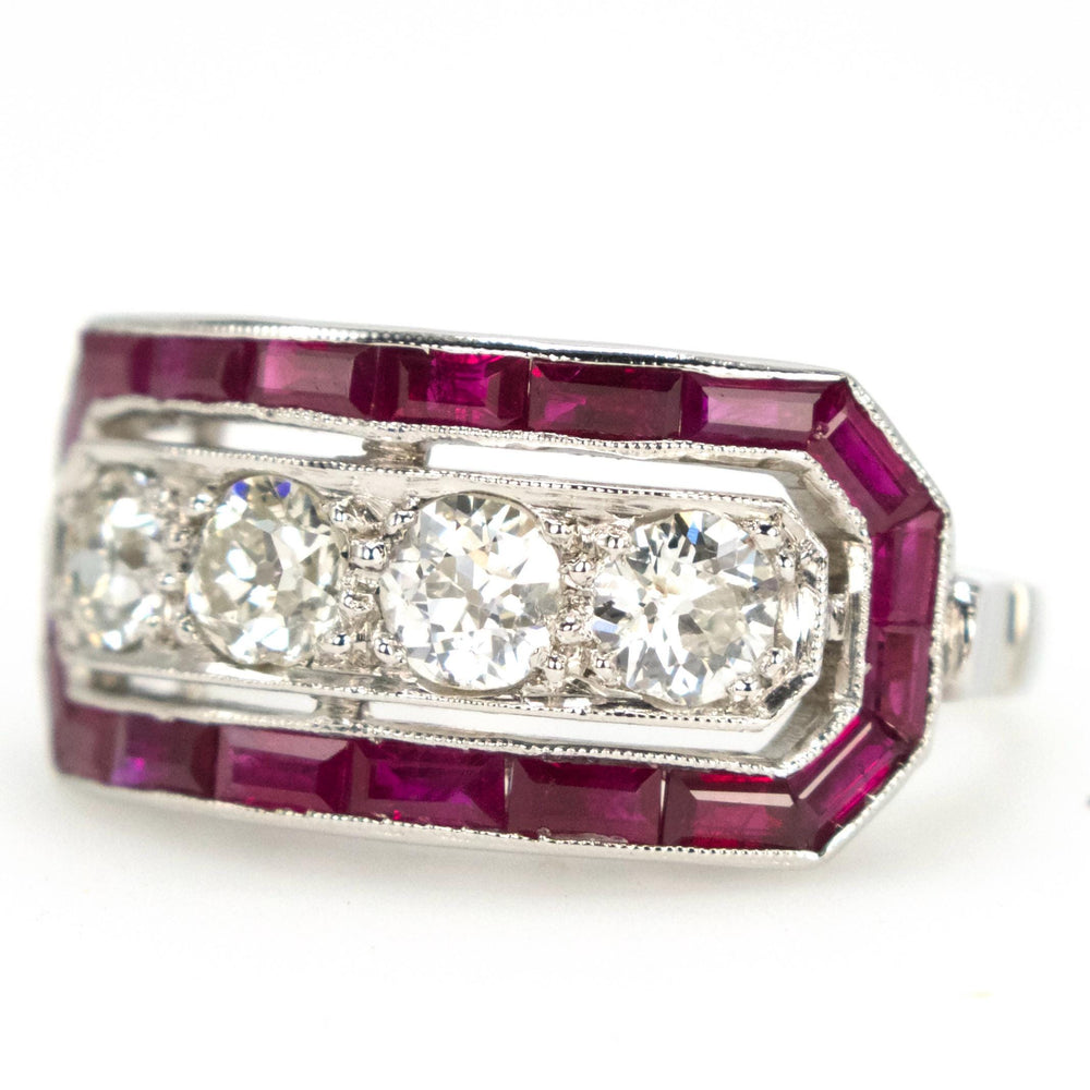 Art Deco Style Four Diamond Ring with Calibre Cut Ruby Surround in Platinum