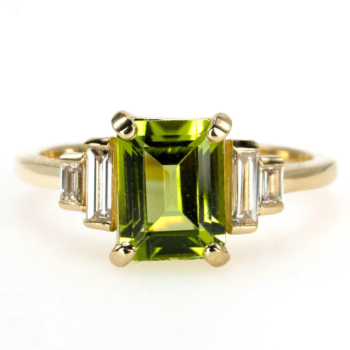 1.40 Carat Emerald Cut Peridot with Graduated Baguette Diamond Accents in Gold