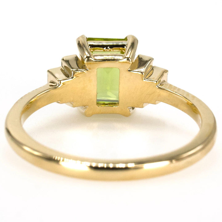 1.40 Carat Emerald Cut Peridot with Graduated Baguette Diamond Accents in Gold