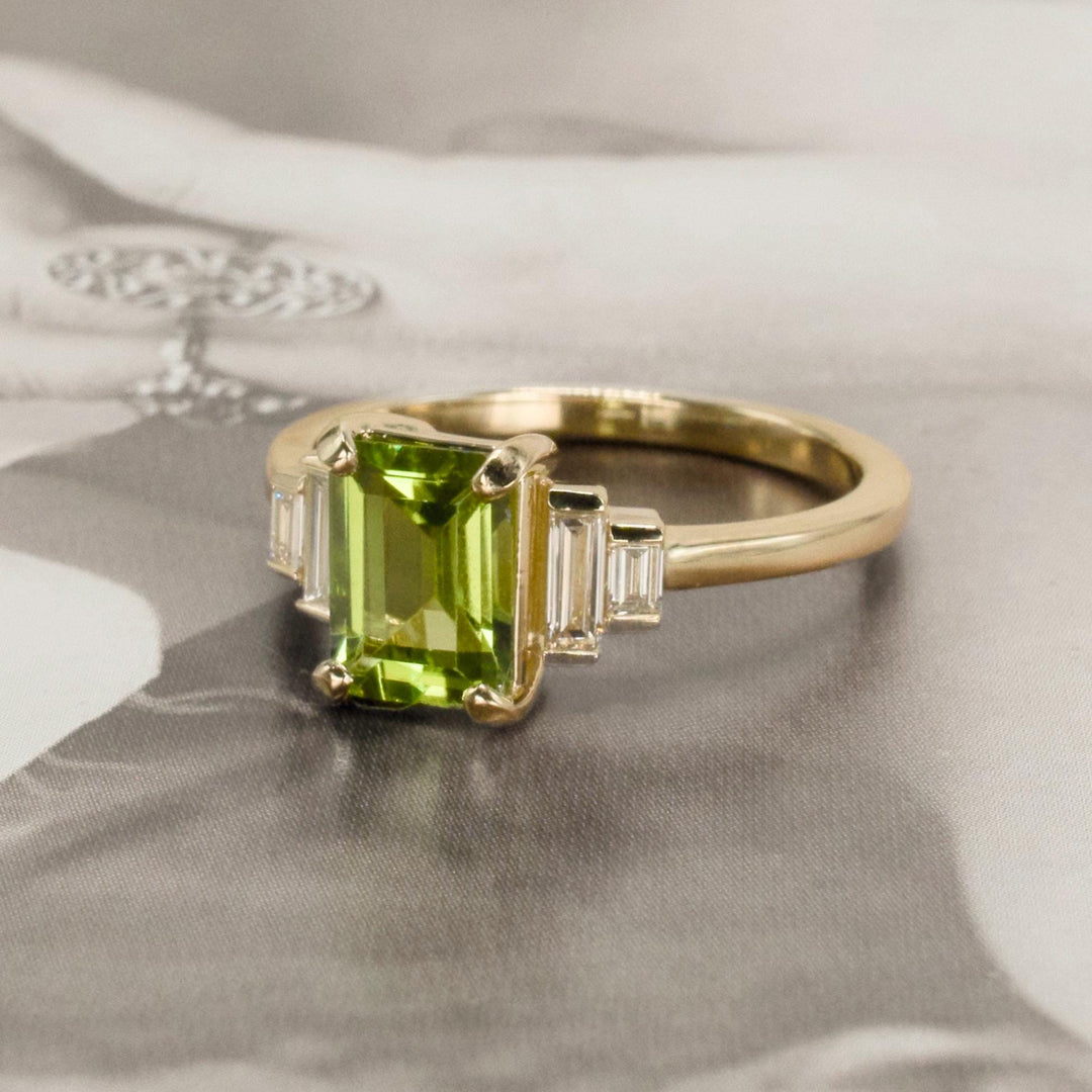 1.40 Carat Emerald Cut Peridot with Graduated Baguette Diamond Accents in Gold