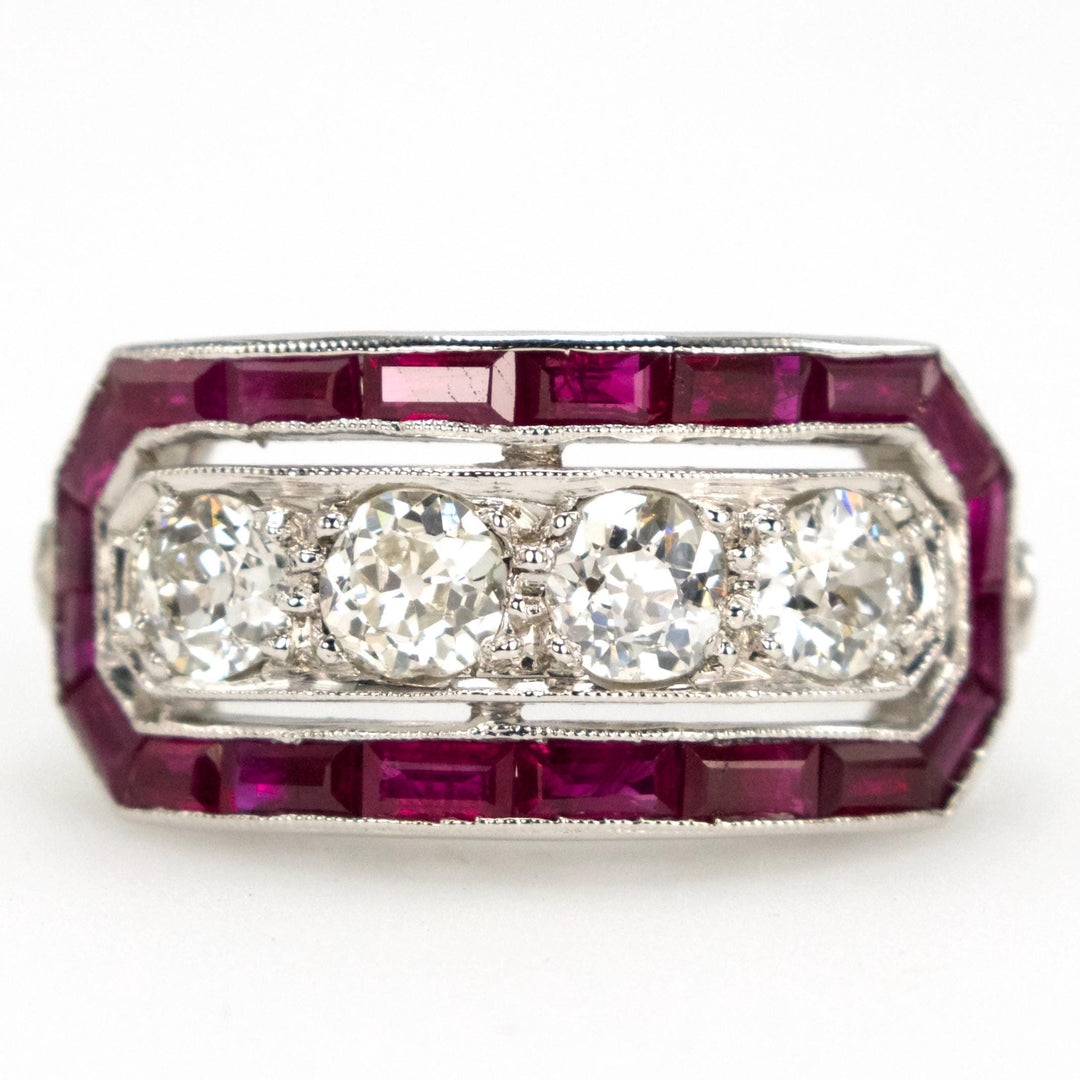 Art Deco Style Four Diamond Ring with Calibre Cut Ruby Surround in Platinum