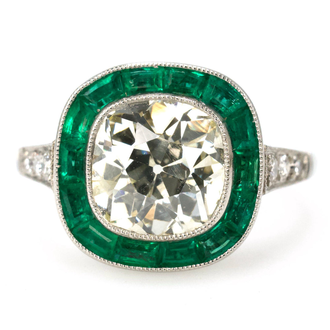 Platinum Art Deco Style Diamond Solitaire with 2.76 Carat Antique Cushion Cut and Emerald Halo