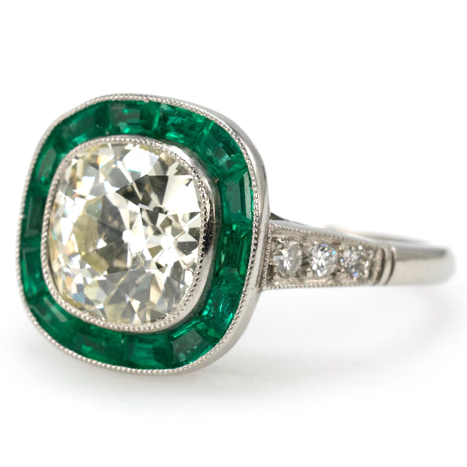 Platinum Art Deco Style Diamond Solitaire with 2.76 Carat Antique Cushion Cut and Emerald Halo