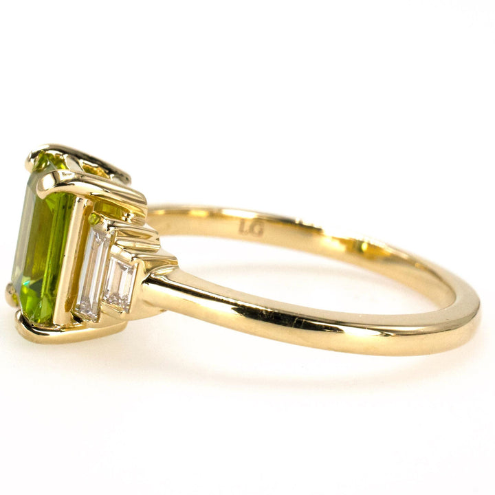 1.40 Carat Emerald Cut Peridot with Graduated Baguette Diamond Accents in Gold