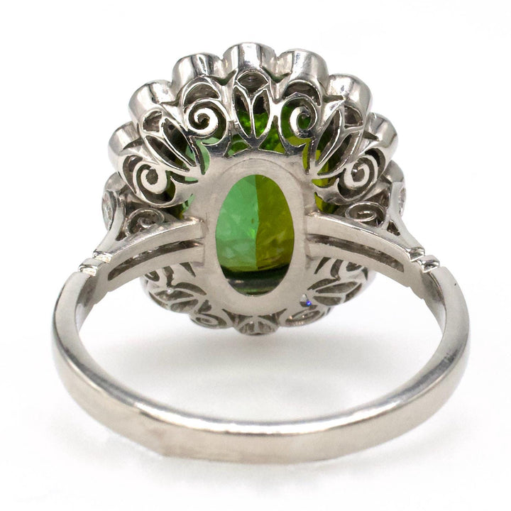 Art Deco Style Platinum Ring with 4.81 Carat Green Tourmaline and Bezel Set Diamond Halo