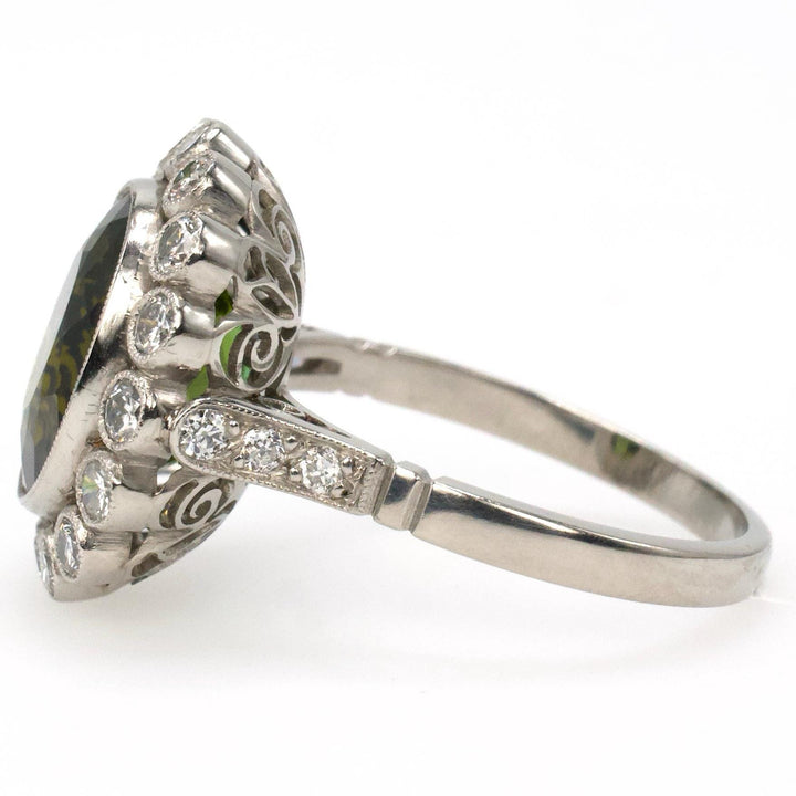 Art Deco Style Platinum Ring with 4.81 Carat Green Tourmaline and Bezel Set Diamond Halo