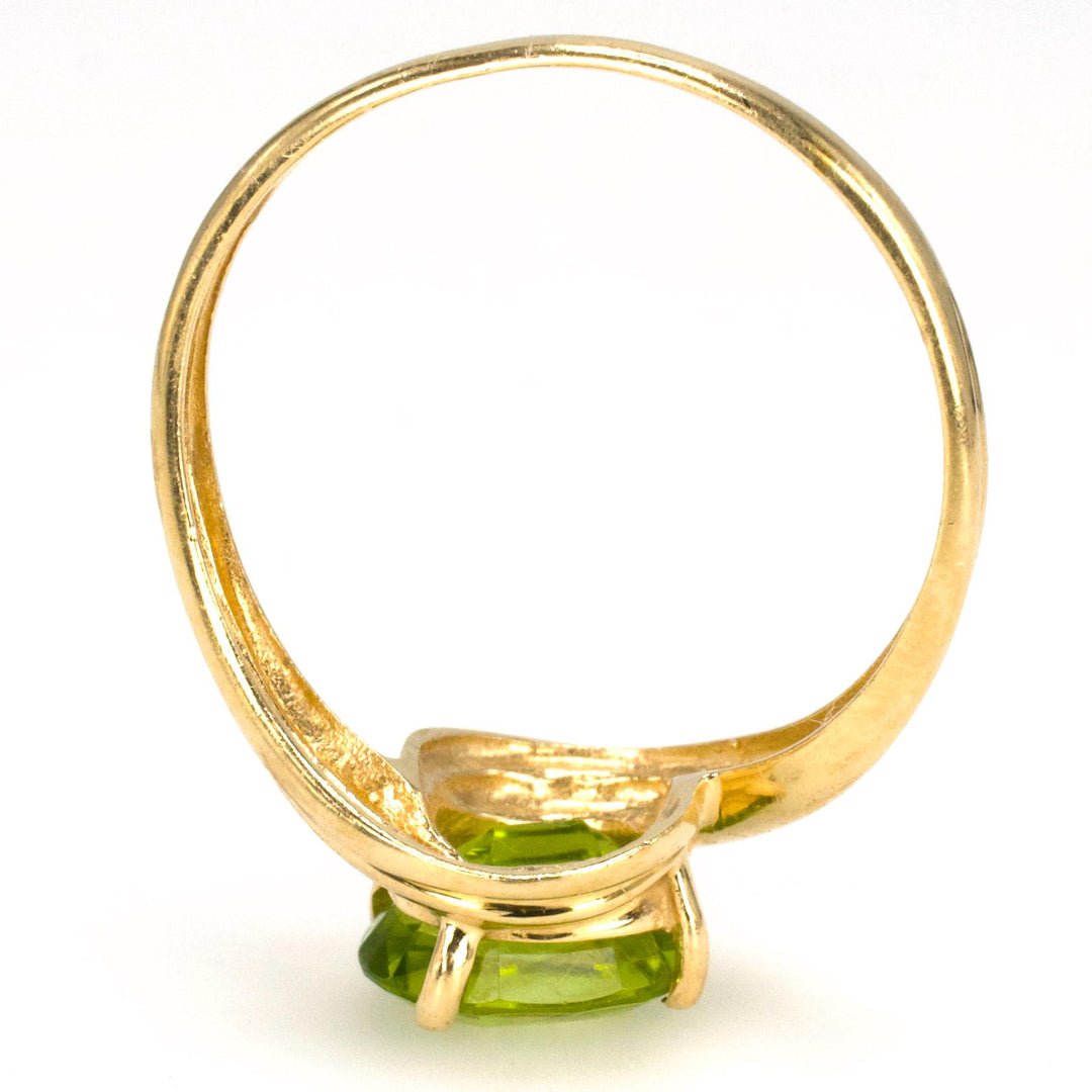 Diagonally Set Oval Peridot Bypass Style Solitaire in Gold