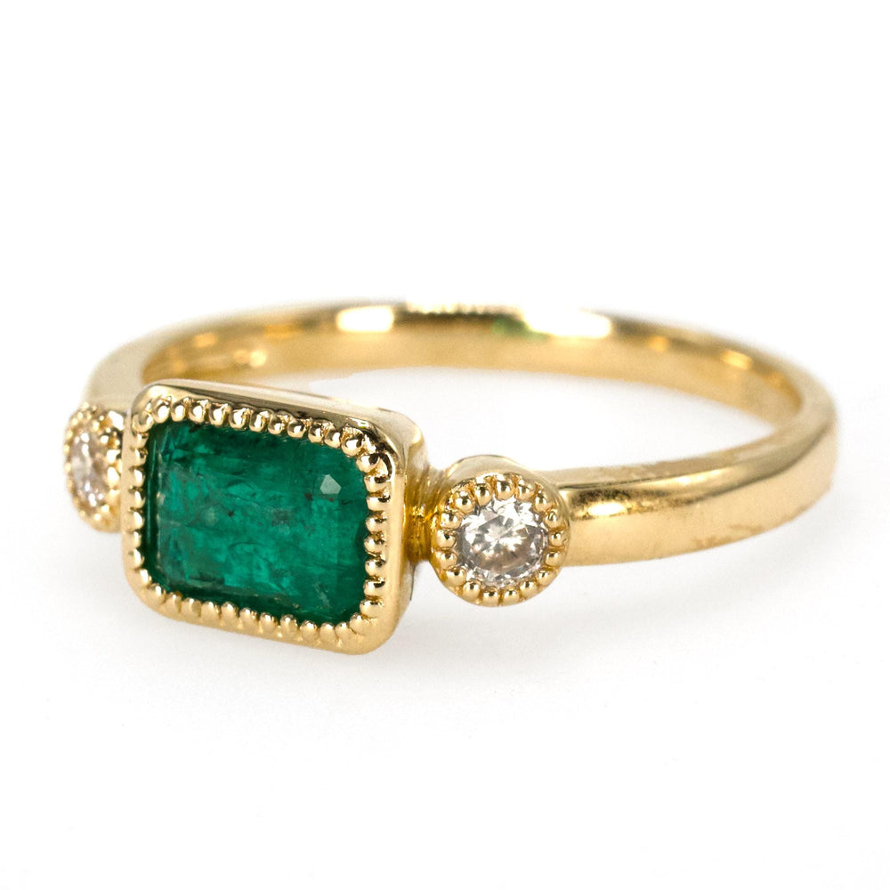 East-West Bezel Set Emerald Ring with Round Accent Diamonds in Gold