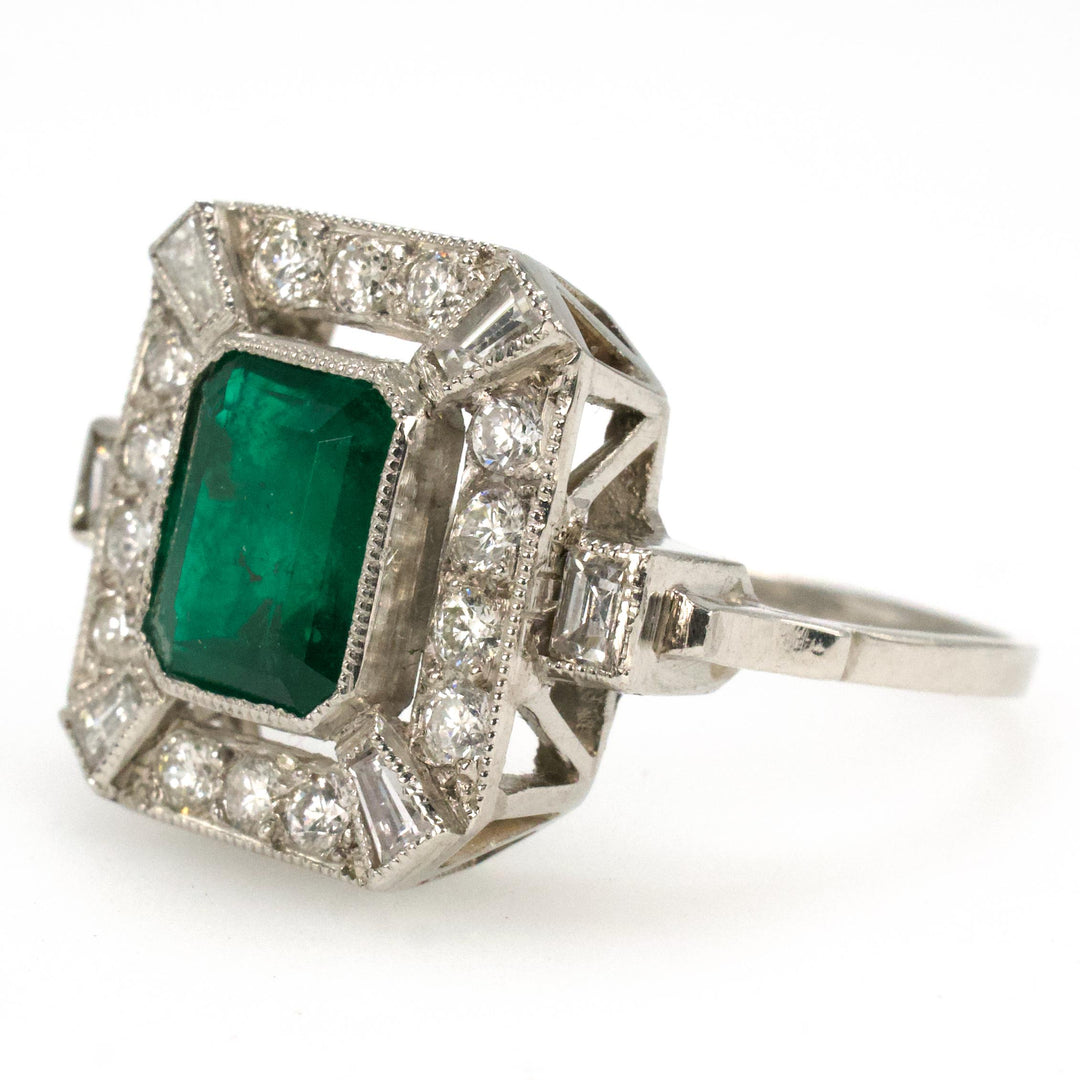 Estate 1.40 Carat Emerald Cut Emerald in Art Deco Style White Gold Setting with Diamond Halo